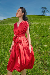 Silk midi dress with cinched waist and flutter sleeves in flowy silhouette for refined femininity